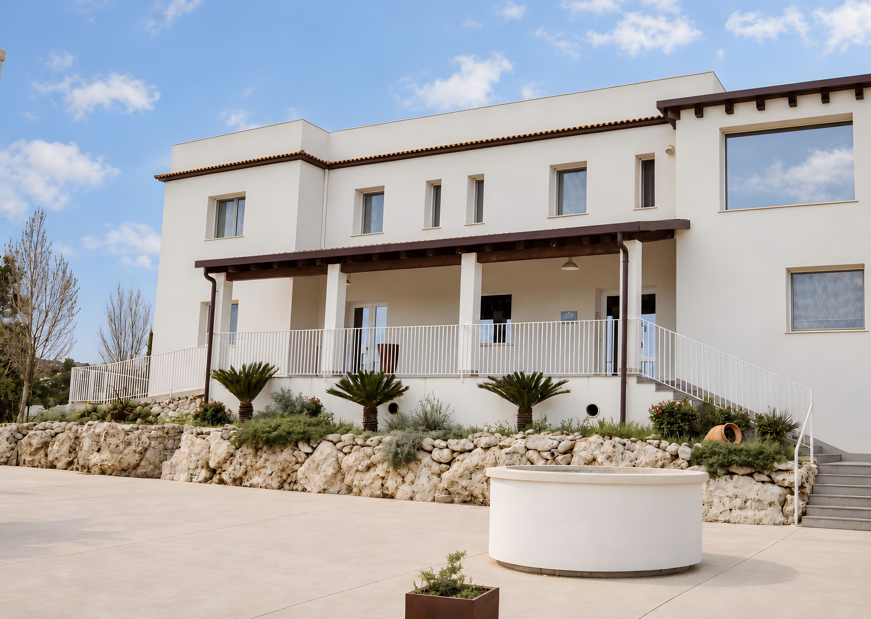 The white facade of the farmhouse