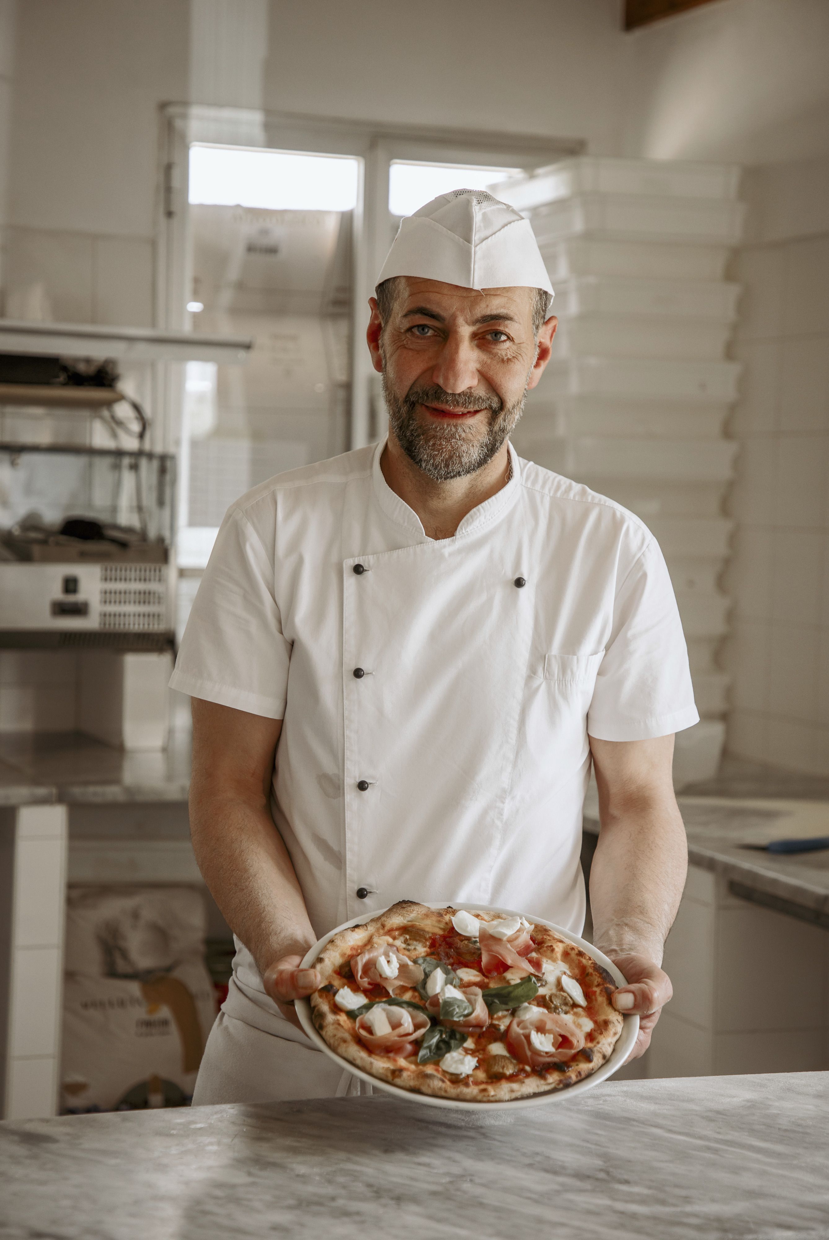 Our pizzaiolo with a pizza